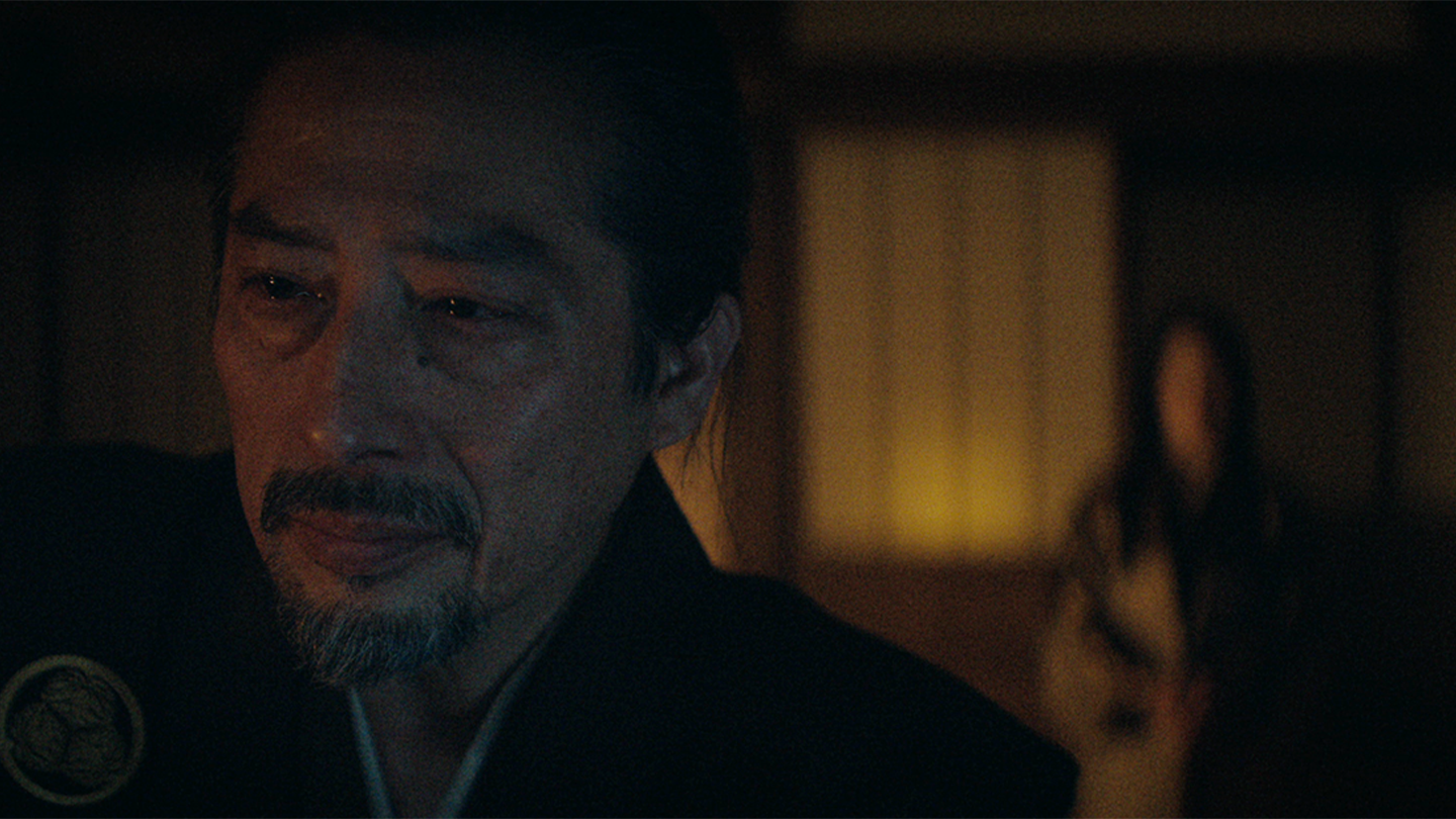 Close up of a pensive Toranaga with Mariko in the background