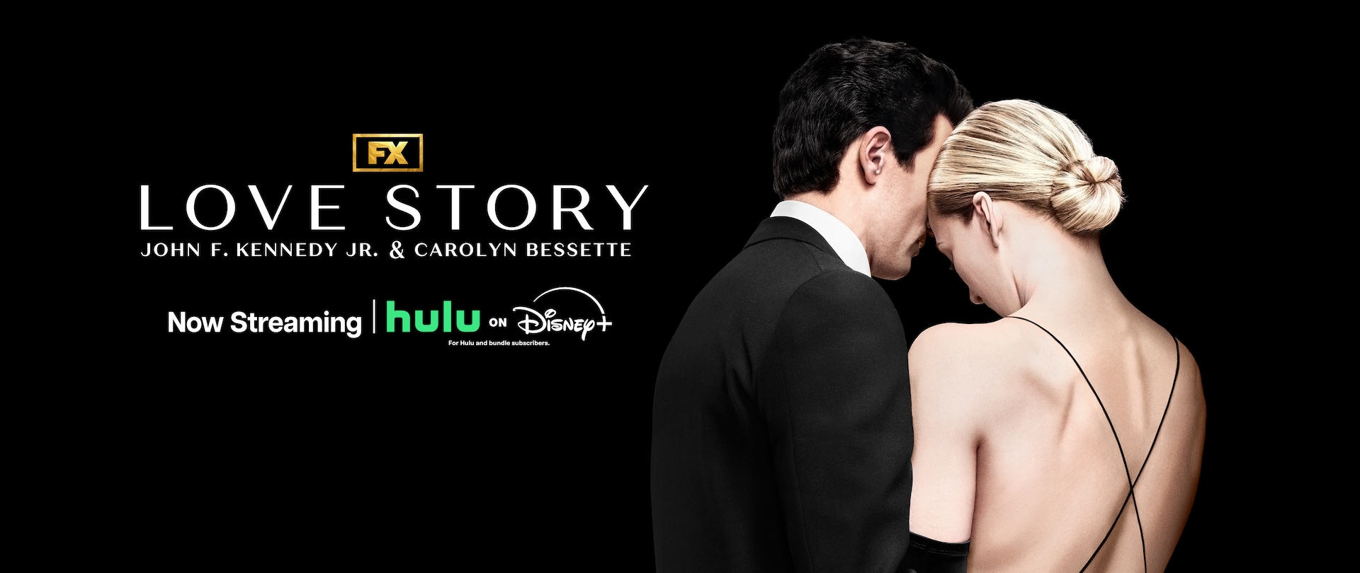 Backs of the characters of JFK Jr. & Carolyn Bessette