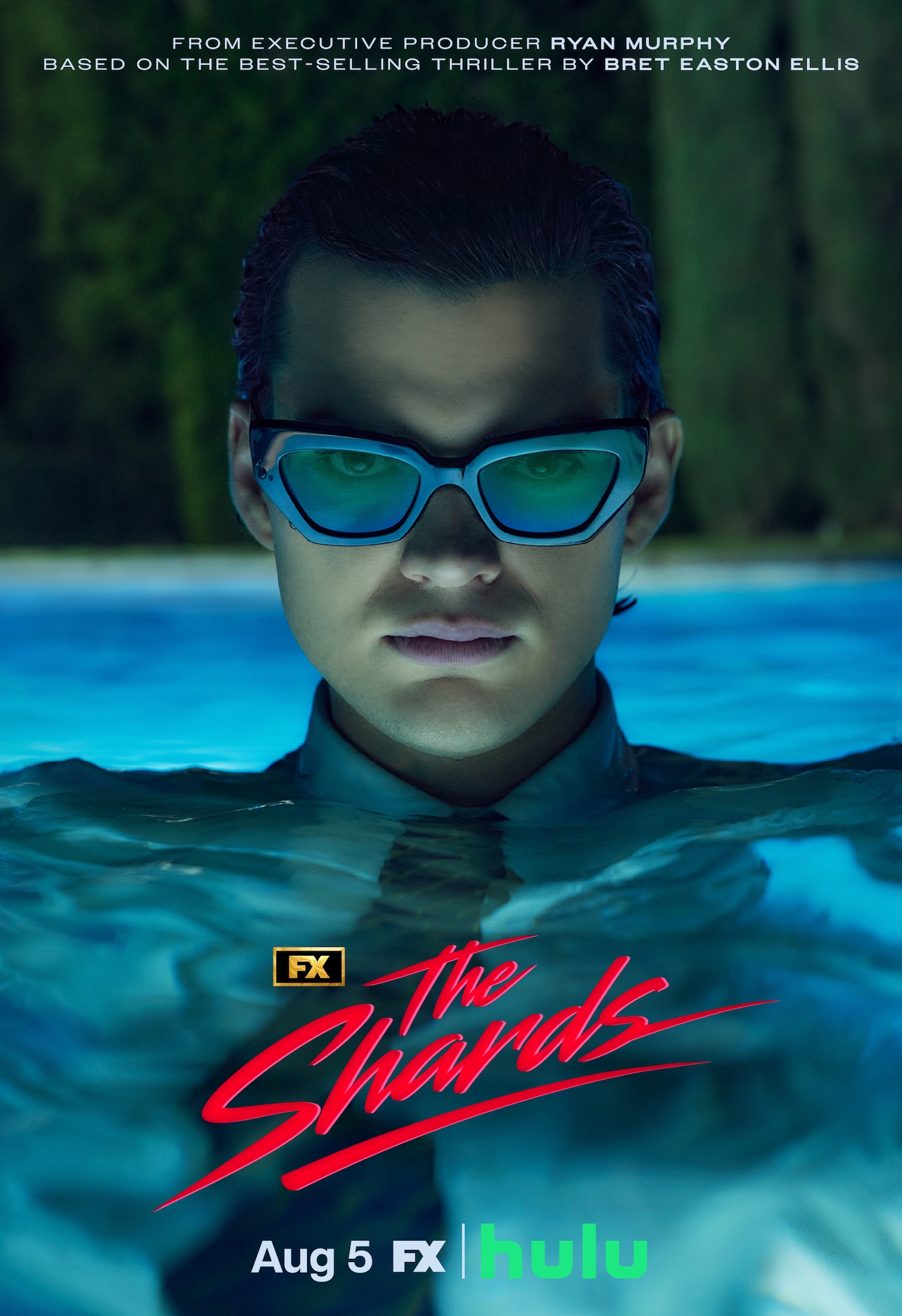 FX's The Shards Homer Gere, wearing a full suit and sunglasses underwater in a pool.
